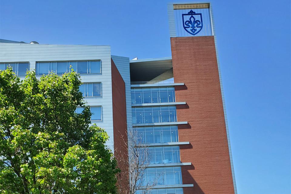 External image of Doisy Hall with new Fleur di Lis shield